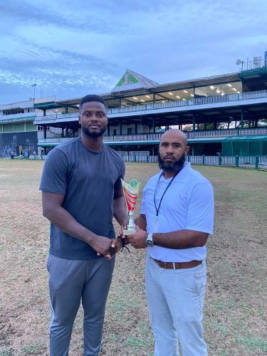 Berbice’s Romario Shepherd receives his Man-of-the-Match award from GCB Cricket Operations Manager Anthony D’Andrade