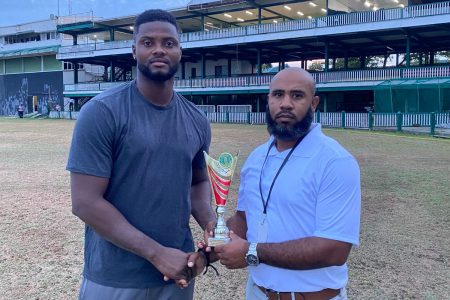 Berbice’s Romario Shepherd receives his Man-of-the-Match award from GCB Cricket Operations Manager Anthony D’Andrade