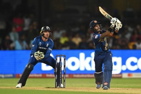 Sri Lanka’s Pathum Nissanka launches one over the top during his unbeaten 77 while England’s wicketkeeper Jos Buttler looks on