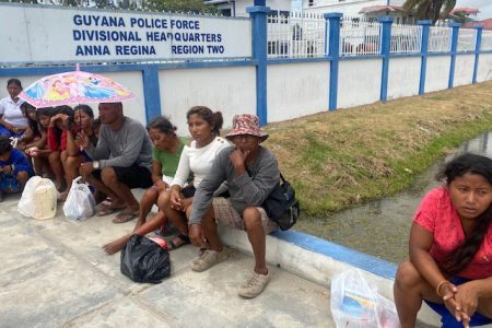 Some of the migrants outside of the Anna Regina police station yesterday