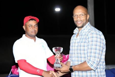 Champion! Avinash Persaud collects his trophy for winning the event.