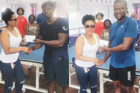 Former national women’s champion Jody Ann Blake presents Christopher Franklin, right, with his cash prize and national table tennis coach Idi Lewis with a cash donation