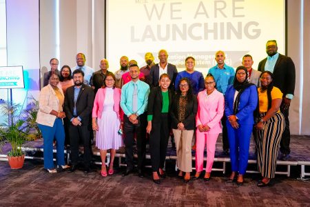 The launching of the EMIS, Minister of Education Priya Manickchand is fourth from right in the back row. (Ministry of Education photo)