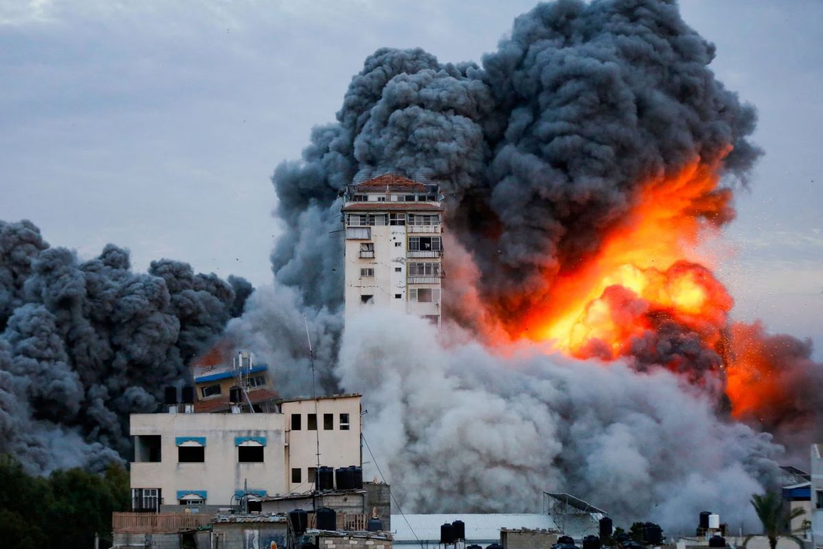 Smoke and flames billow after Israeli forces struck a high-rise tower in Gaza City, October 7. REUTERS/Ashraf Amra
