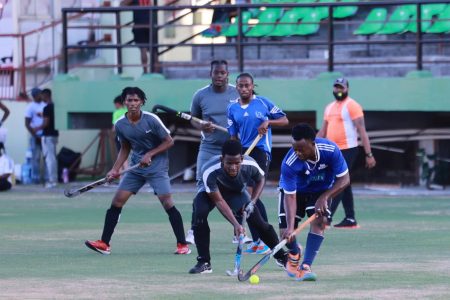 Action in the GHB Farfan & Mendes men’s first-division league at the Providence National Stadium Sunday