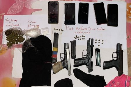 The guns and suspected drugs (Police photo)