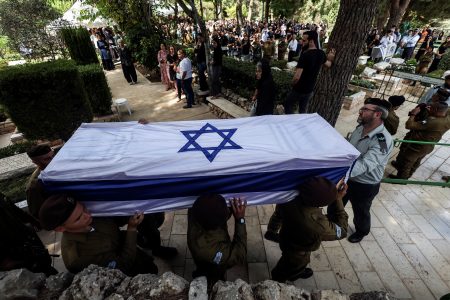 Soldiers carry the coffin of Adi Zur, a soldier who was slain in the assault on Israel by Hamas gunmen from the Gaza Strip, at their funeral at Mount Herzl Military Cemetery in Jerusalem, October 11. REUTERS/Ronen Zvulun