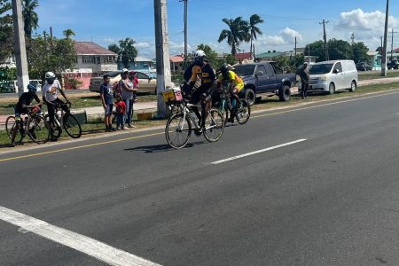 James Joelyn Joseph crosses the finish line ahead of Junior Niles to win the Veterans Over-50 race.
