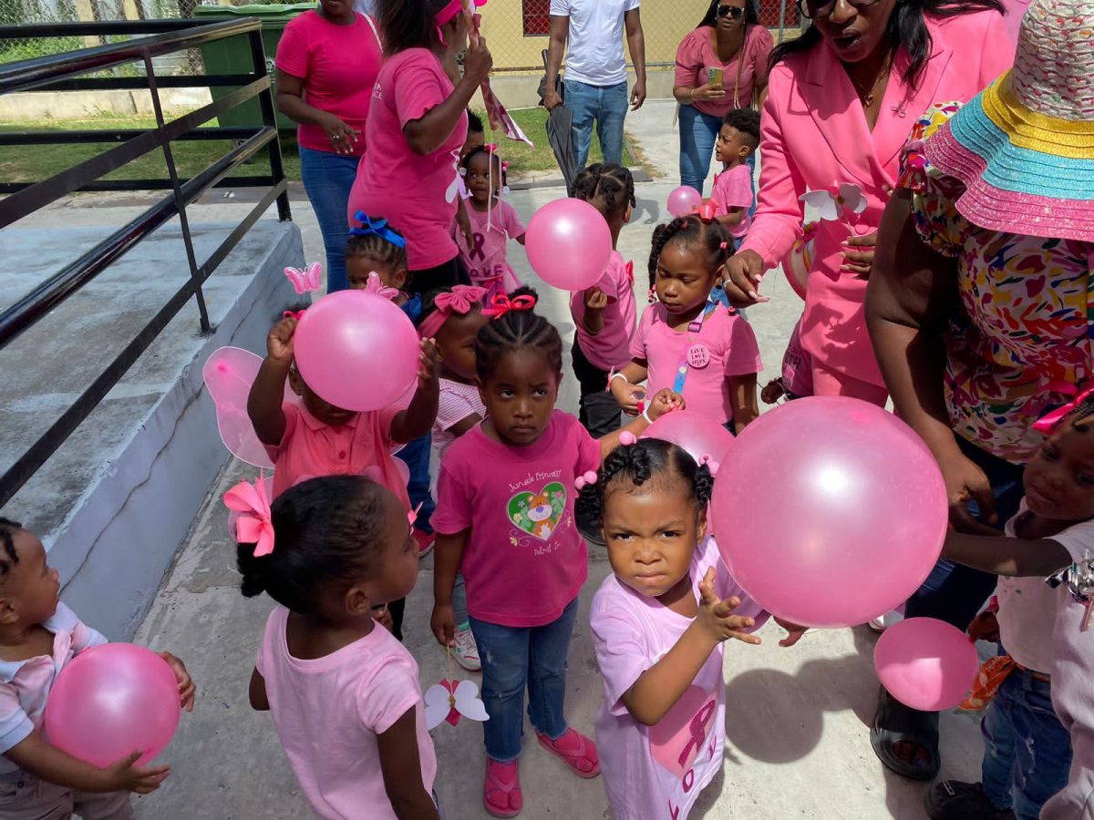 The Guyana Police Force’s Juliet Griffith Daycare Centre’s children, parents and teachers came together on Friday to support the fight against cancer by participating in a Pink Cancer Awareness Walk around the Eve Leary Headquarters. During the walk, the excited crowd was entertained by the ‘Corp Drums’ of the Guyana Police Force. The Walk’s slogan was: “Walking for Hope, Closing the Care Gap!” (Police photo)
