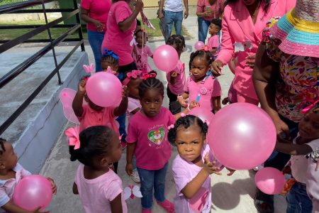 The Guyana Police Force’s Juliet Griffith Daycare Centre’s children, parents and teachers came together on Friday to support the fight against cancer by participating in a Pink Cancer Awareness Walk around the Eve Leary Headquarters. During the walk, the excited crowd was entertained by the ‘Corp Drums’ of the Guyana Police Force. The Walk’s slogan was: “Walking for Hope, Closing the Care Gap!” (Police photo)
