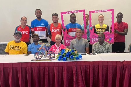 (Sitting) From right, KARCC President- Gary Alleyne, KARCC VP- Mark St Claire, Cancer Foundation’s Bibi Hassan, GCF President Horace Burrowes, Flying Stars’ Victor Rutherford and participating cyclists pose at the launch of ‘Fireworks 2: The Pink Edition’ on Friday.
