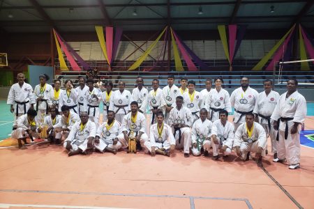 The respective winners and top three finishers pose with their spoils following the conclusion of the Senior National Championship at the National Gymnasium