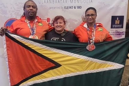 Roger Rogers (left) and Nadina Taharally (right) pose with Jackie Blasberry (center) and their medals at the World Classic and Equipped Masters Powerlifting Championships in Ulaanbaatar, Mongolia yesterday.