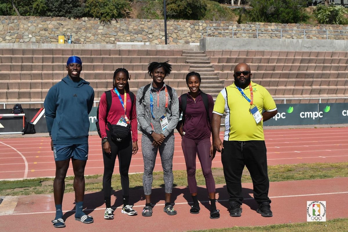 Track athletes, Emanuel Archibald, Jasmine Abrams, Keliza Smith, Aliyah Abrams and Coach, Johnny Gravesande posed for a photo yesterday following a practice session. 
