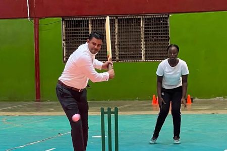 Minister of Culture, Youth & Sport, Charles Ramson Jr., took first strike as the Janet Jagan Birth Anniversary Schoolgirls windball cricket competition bowled off at the National Gymnasium yesterday