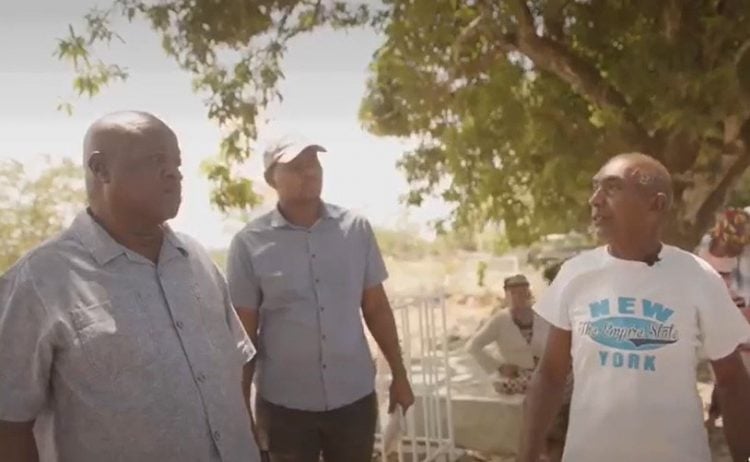 A concerned resident (right) sharing his frustration with Opposition Leader Aubrey Norton.
