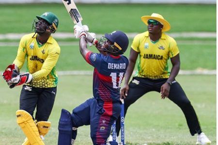 CCC Marooners left-handed batsman Demario Richards (centre) swings into the leg-side during his 71 watched by Jamaica Scorpions wicketkeeper Chadwick Walton (left) and captain Rovman Powell at slip. (CWI Media)
