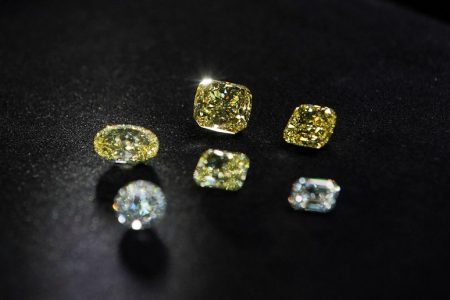 FILE PHOTO: A view shows polished colorless and yellow diamonds produced at "Diamonds of ALROSA" factory in Moscow, Russia April 30, 2021. REUTERS/Tatyana Makeyeva/File Photo