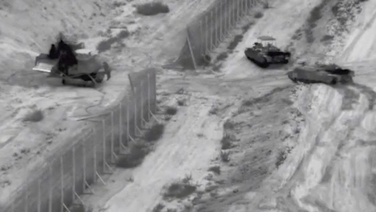 Israeli armoured vehicles take part in an operation, as the conflict between Israel and Hamas continues, at a location given as the northern Gaza Strip in this still image taken from handout video released October 26, 2023. Israel Defense Forces/Handout via REUTERS