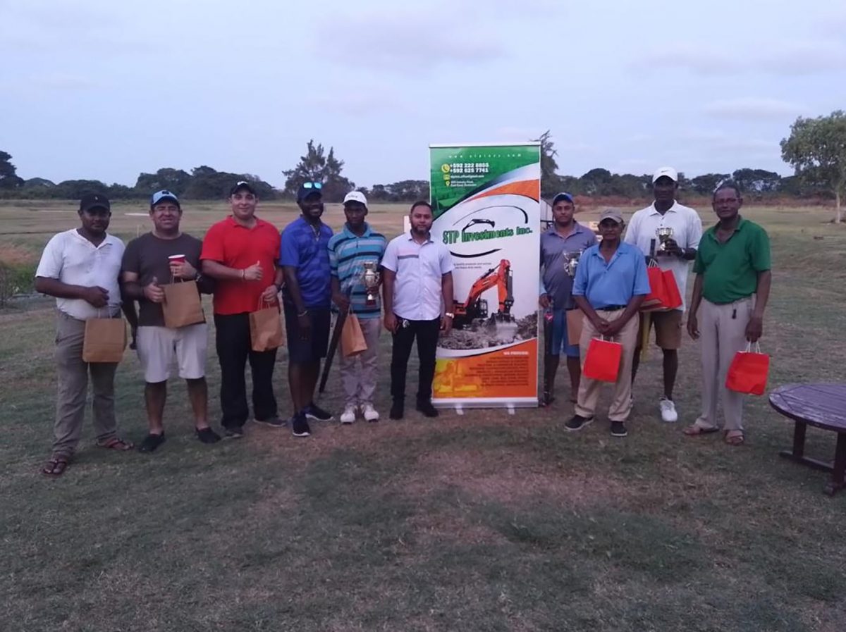 The various winners of the STP Investment Inc., golf tournament pose with their spoils
