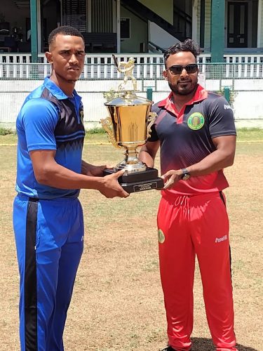 Demerara skipper Tevin Imlach, left and Veerasammy Permaul, Berbice captain with the One-Day Inter County trophy which is at stake in today’s final