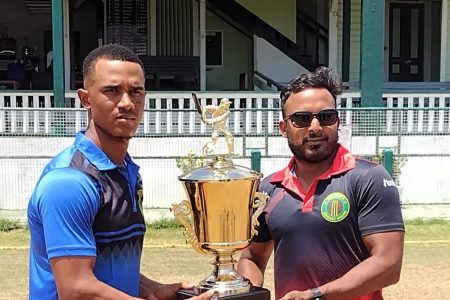 Demerara skipper Tevin Imlach, left and Veerasammy Permaul, Berbice captain with the One-Day Inter County trophy which is at stake in today’s final
