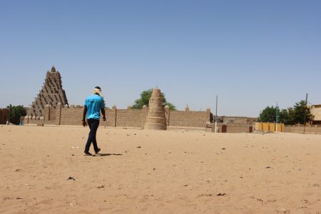 A man walks toward Sankore mosque, also known as the former University of Sankore, in Timbuktu, Mali September 25, 2023. REUTERS/Stringer