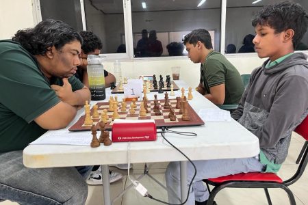 Focused! Candidate Master Taffin Khan (left) is a picture of concentration in his match against Sachin Pitamber.