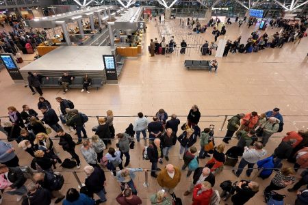 Passengers wait at the reopened terminal of Hamburg Airport following a security incident, in Hamburg, Germany, November 5, 2023. REUTERS/