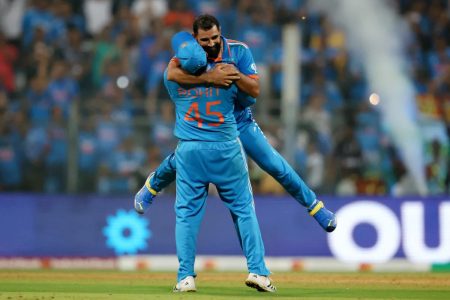 India’s Captain Rohit Sharma and Mohammed Shami the semifinal victory against New Zealand after the latter claimed the final wicket to finish with figures of 7-57