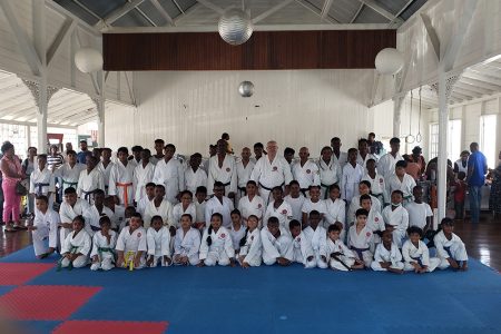 Participants and instructors pose for the camera at the recently concluded ASK
grading examinations on November 5th at the YMCA Dojo on Thomas Lands.
