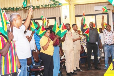Lindeners waving the Guyana flag in solidarity (DPI photo)