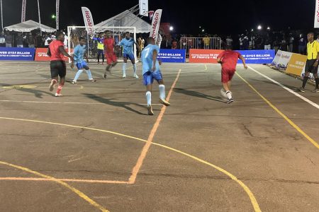 A scene from the New Era Futsal Championship between Young Gunners and Coomacka (red)