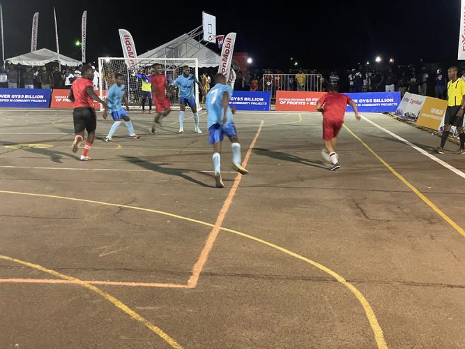 A scene from the New Era Futsal Championship between Young Gunners and Coomacka (red)