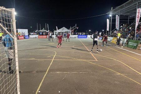 Part of the action in the New Era Futsal Championship on Saturday night at the Retrieve Tarmac in Linden
