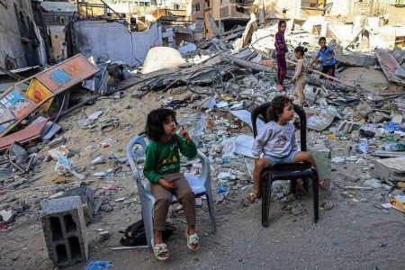 Palestinian children sit in front of the rubble of a destroyed building in Rafah in the southern Gaza Strip on Nov 6. PHOTO: AFP