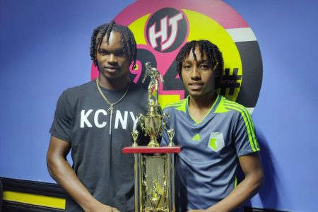 Sideline captain Jerome Harrigon (left) and Republic drive skipper Brandon Solomon are posing with the championship trophy