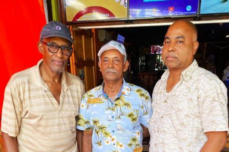 Chess players of yesteryear! Overseas-based Guyanese Christopher Shervington (left) and Andrew Walker (right), flank Rai Sharma. Walker was a former junior champion of Guyana, and Shervington was a tournament director and senior administrative official of the Guyana Chess Federation.  
