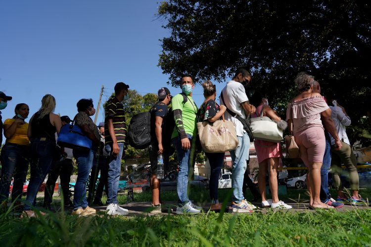 People wait their turn for visa procedures nearby the embassy of Panama in Havana, Cuba, June 13, 2022. Picture taken on June 13, 2022. REUTERS/Alexandre Meneghini