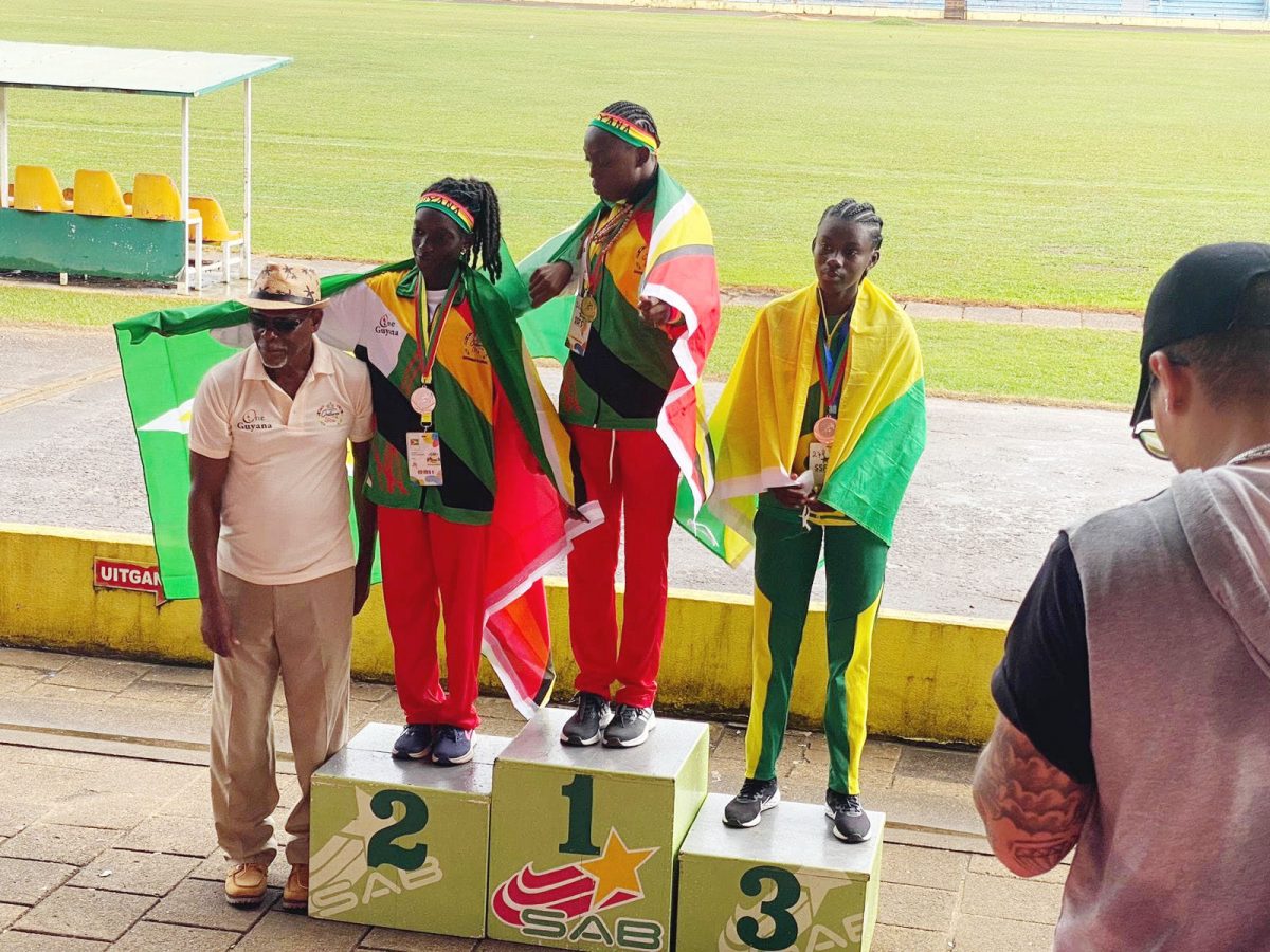 Guyana one-two! Marissa Thomas (centre) and Esther Mckinnon (left) landed Gold and Silver medals in the
 Girls 1500m event.