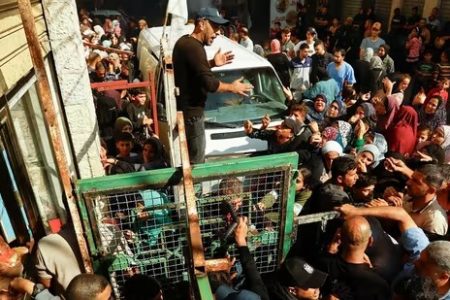 Palestinians queue as they wait to buy bread from a bakery, amid shortages of food supplies and fuel, as the conflict between Israel and Palestinian Islamist group Hamas continues in Khan Younis in the southern Gaza on November 17.(Reuters)