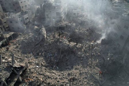 Palestinians gather at the site of Israeli strikes on houses in Bureij in the central Gaza Strip,November 2, 2023. (REUTERS)