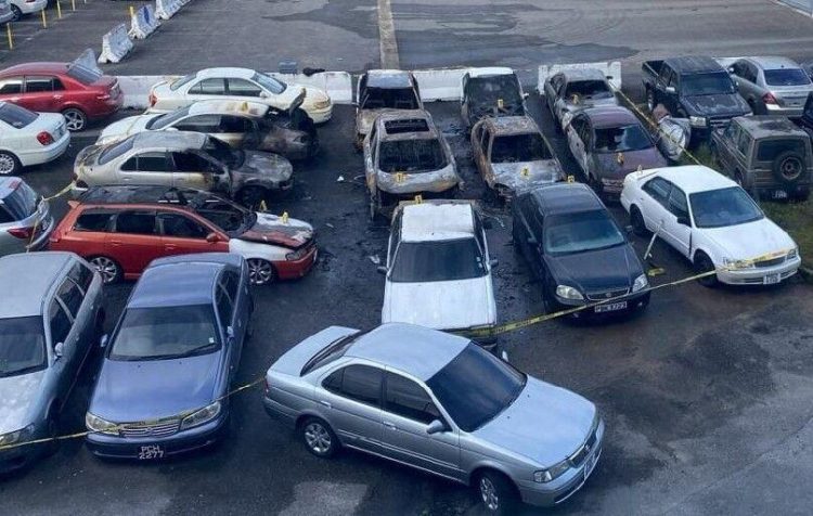 An aerial view of the impounded vehicles which were destroyed in an early morning fire at the Caroni Licensing Office compound yesterday. Fourteen cars were said to have been destroyed in the blaze.