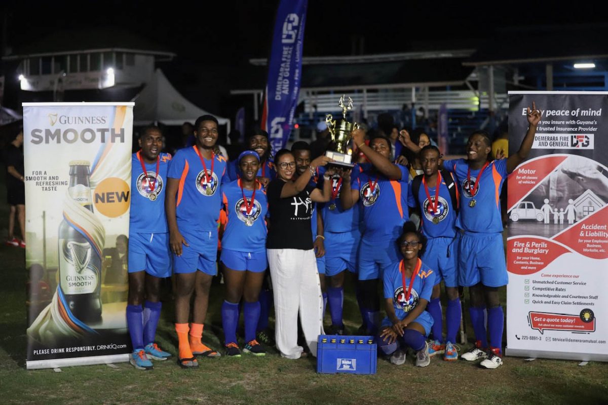 The victorious Jai Signs team celebrates with their trophy after beating Giftbox 2-0 in the final of the Hikers Mixed 7-A-Side Hockey Festival on Monday

