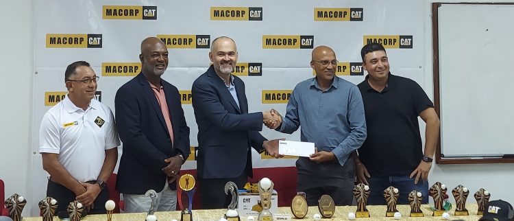 MACORP’s General Manager, German Consuegra (left), presents the sponsorship cheque from LGC President Patanjilee Persaud in the presence of other members of the company and the LGC.