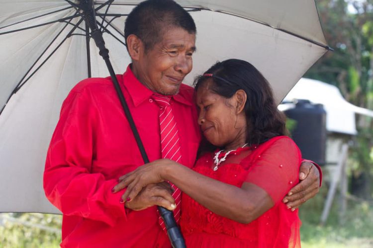 Emotional: This couple is emotional after being wedded recently at Baramita, North West District, Region One. Over a period of four days, September 27th to 30th
the General Register Office, led by Deputy Registrar General Visham Budhoo,
married some 25 couples in the community. (Ministry of Home Affairs photo)
