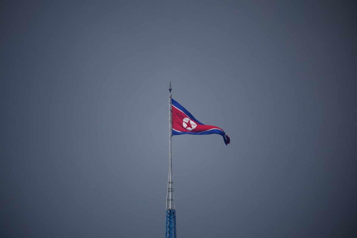 A North Korean flag flutters at the propaganda village of Gijungdong in North Korea, in this picture taken near the truce village of Panmunjom inside the demilitarized zone (DMZ) separating the two Koreas, South Korea, July 19, 2022.    REUTERS/Kim Hong-Ji/Pool/Files