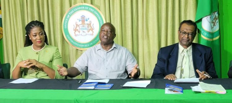 Opposition Leader Aubrey Norton (centre) speaking at the APNU+AFC press conference on Friday at right is AFC Leader Khemraj Ramjattan. At left is shadow foreign minister Amanza Walton-Desir. 