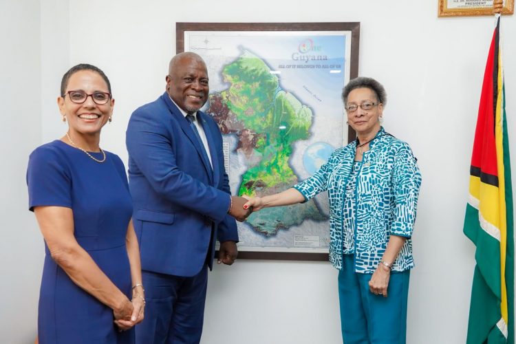 Prime Minister Mark Phillips (second from left) greeting Margarette May Macaulay (Office of the Prime Minister photo)