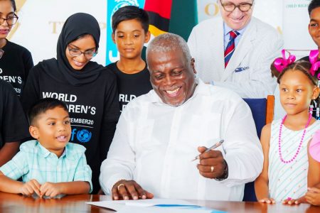 Prime Minister Mark Phillips signing the declaration (Office of the Prime Minister photo)